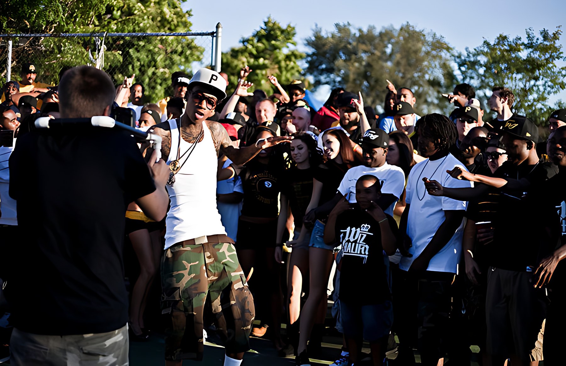 Wiz Khalifa performing for the crowd during the Black and Yellow video shoot