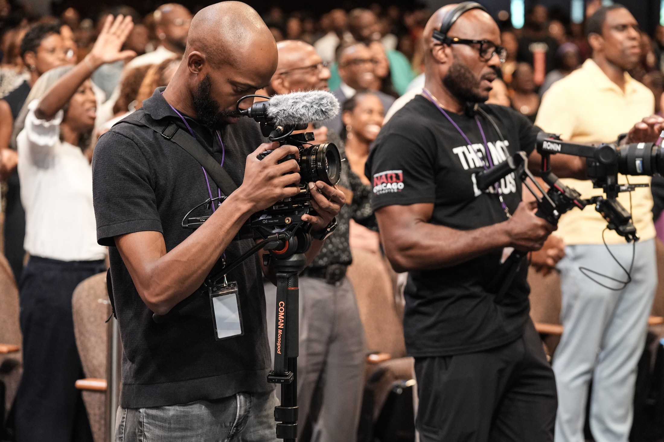Davone and a second operator filming a packed Sunday service