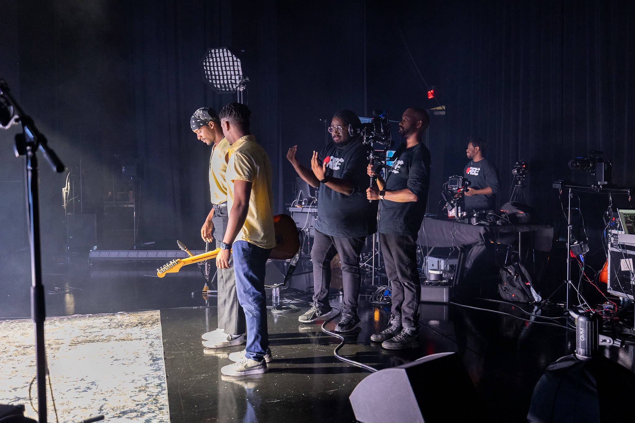 Crew setting up the REC Live stage before a soundcheck